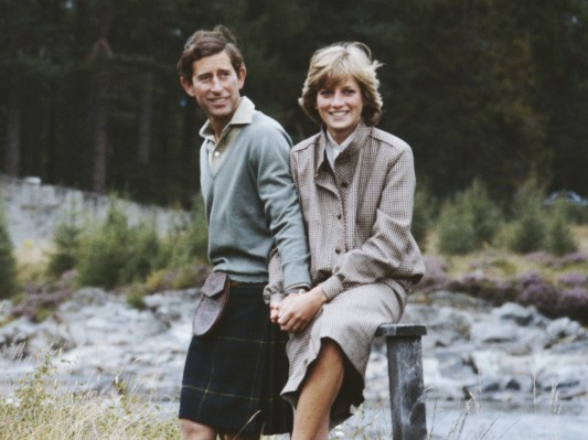Prince Charles (L) and Princess Diana posing for a photo on their honeymoon