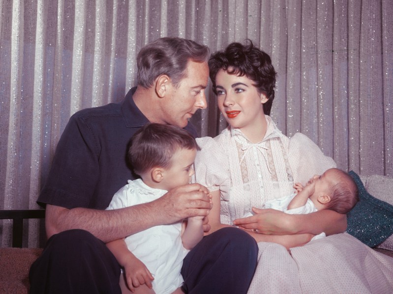 1955 photo of Elizabeth Taylor and Michael Wilding with their sons Michael Jr. (left) and newborn Christopher