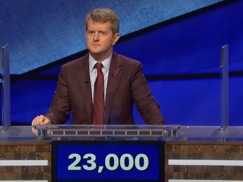 screenshot of Ken Jennings in a brown suit competing on Jeopardy