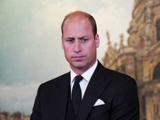 close up of Prince William in a black suit