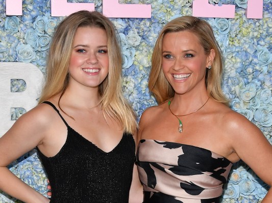 Reese Witherspoon (R) in black and beige dress standing next to Ava Philippe, who is wearing a black dress