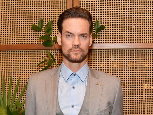 Shane West wearing a grey suit in 2019