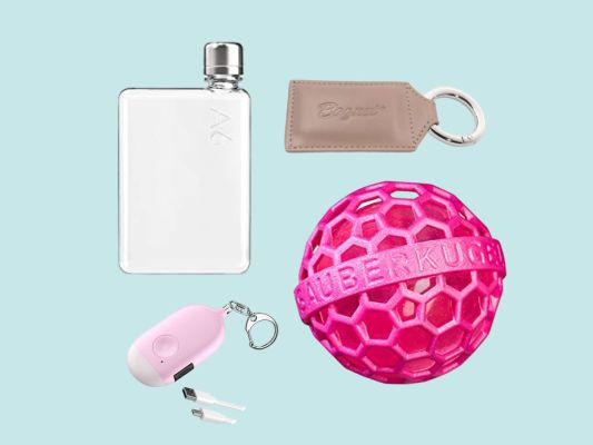 A flask, purse magnet, purse ball cleaner, and purse alarm on a blue background