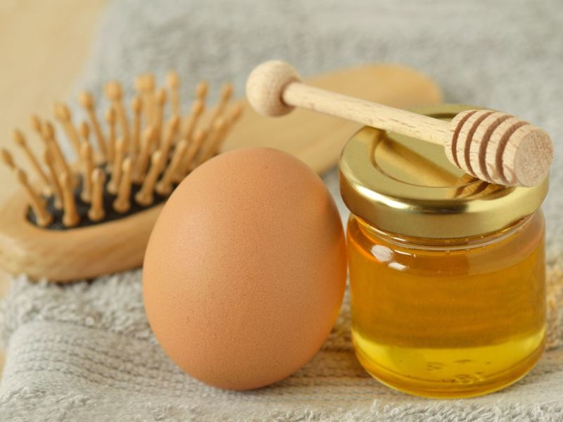 a jar of honey, an egg, and a hairbrush