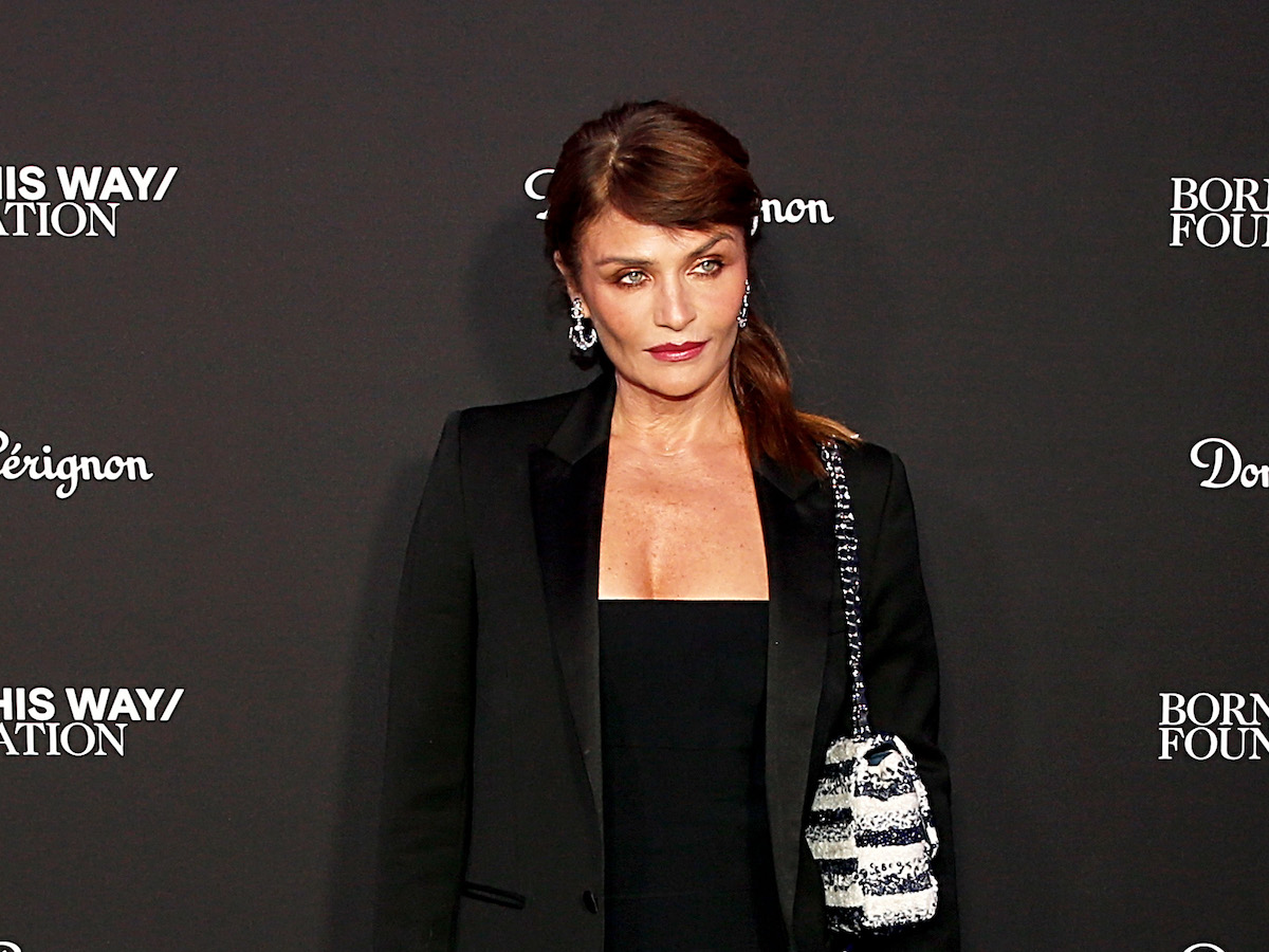 Helena Christensen in November 2021 in a black dress and jacket