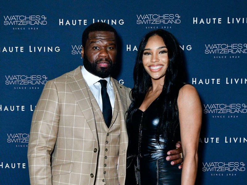 Curtis "50 Cent" Jackson in a tan suit with girlfriend Jamira Haines in a black leather outfit