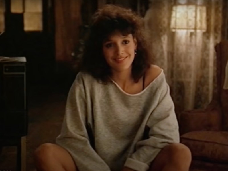screenshot of Jennifer Beals in a grey sweatshirt in Flashdance
