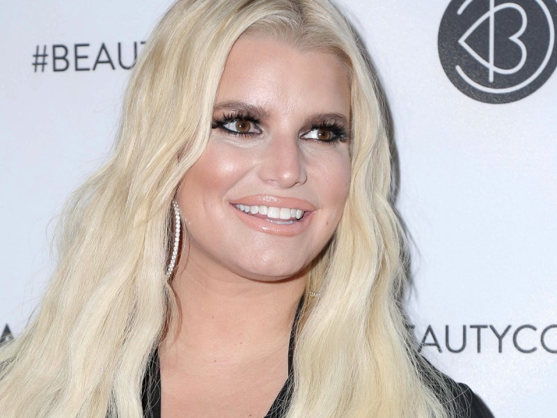 Jessica Simpson smiles in closeup photo wearing black top
