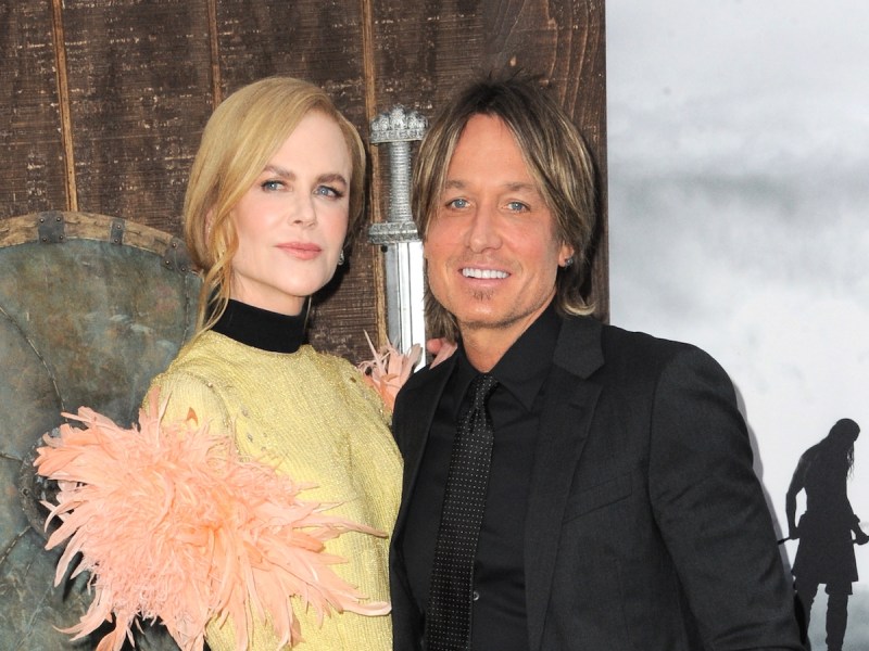Nicole Kidman in a yellow dress with Keith Urban in a black suit