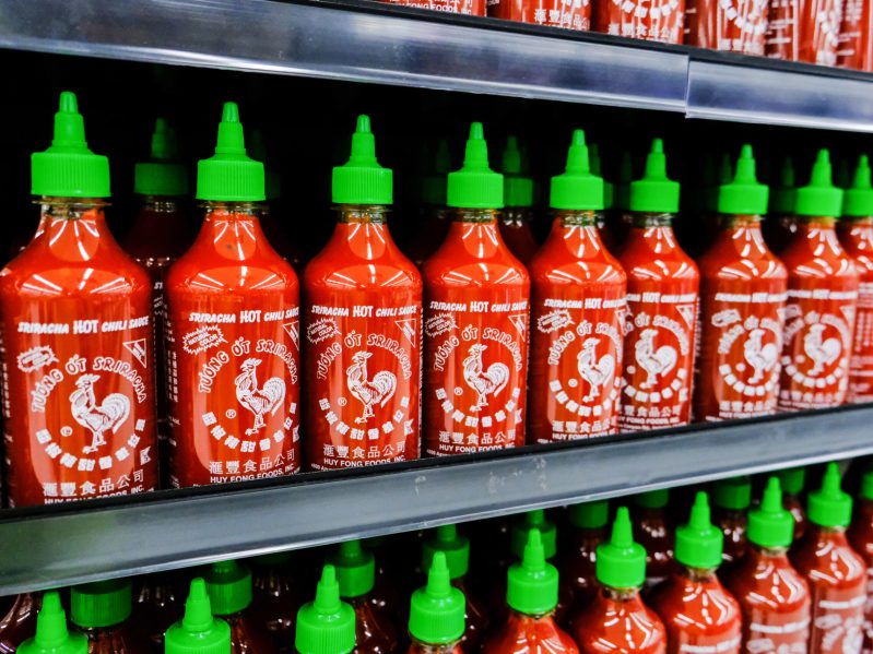 Store shelves filled with Huy Fong Sriracha