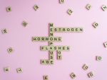 Menopause and other menopause-related words spelled out with Scrabble blocks
