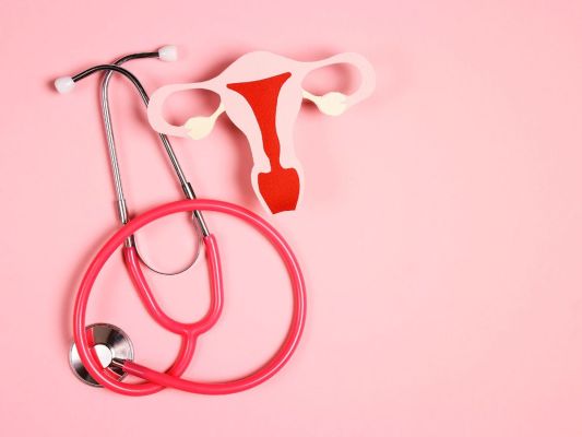 Stethoscope next to model of uterus