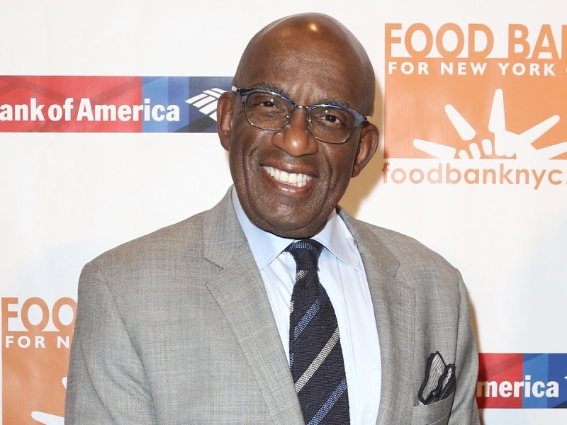 Al Roker smiles in gray suit jacket against white backdrop
