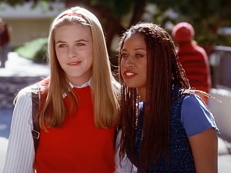 Alicia Silverstone (L) and Stacey Dash standing outside and smiling
