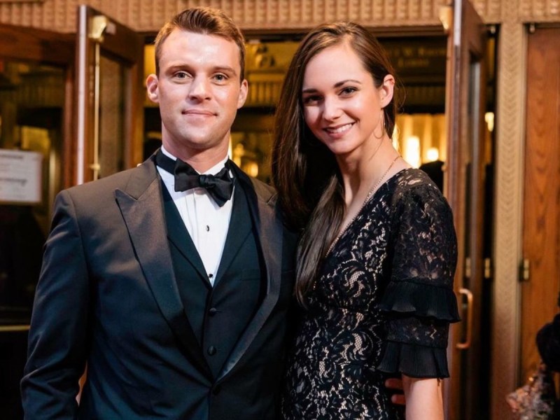 Jesse Spencer (L) poses with Kali Carr in front of a large doorway