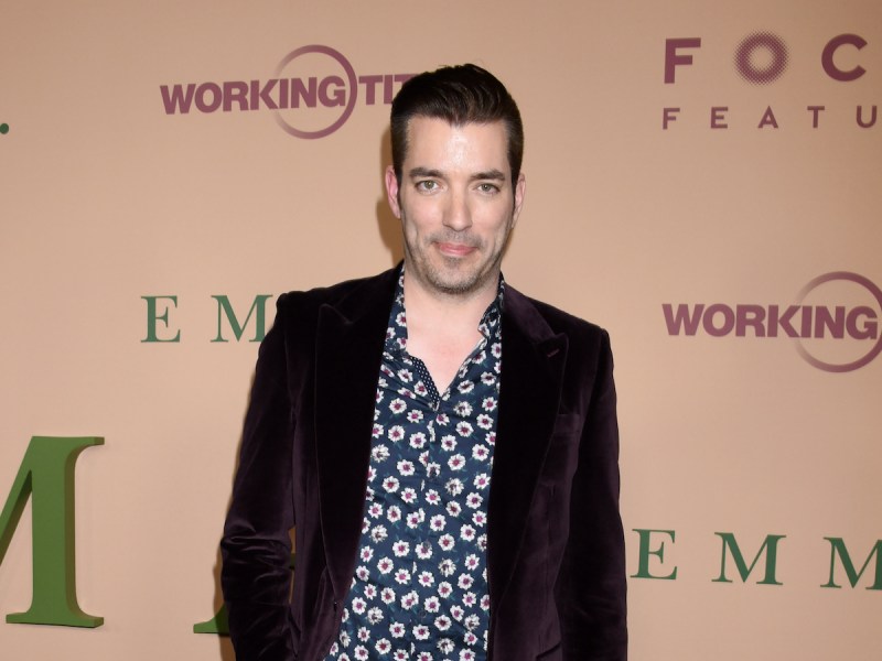 Jonathan Scott smiling in a blue floral shirt and maroon jacket