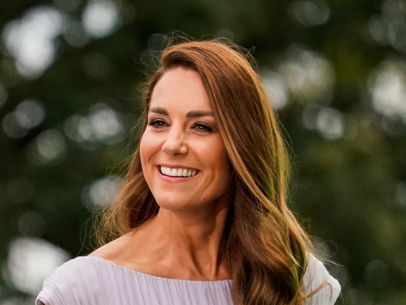 close up of Kate Middleton smiling in a lavender dress