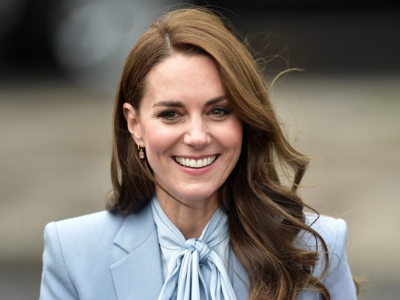 Kate Middleton smiles in powder blue blouse
