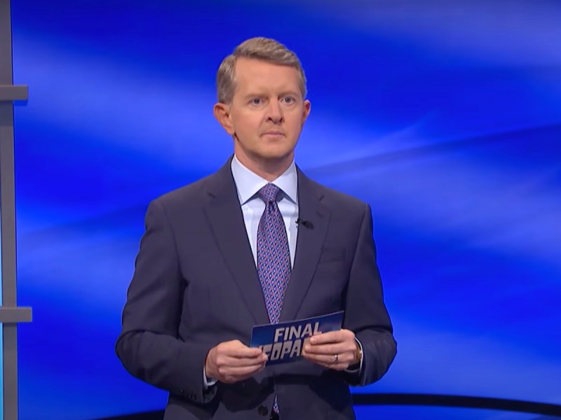 screenshot of Ken Jennings hosting Final Jeopardy in a black suit