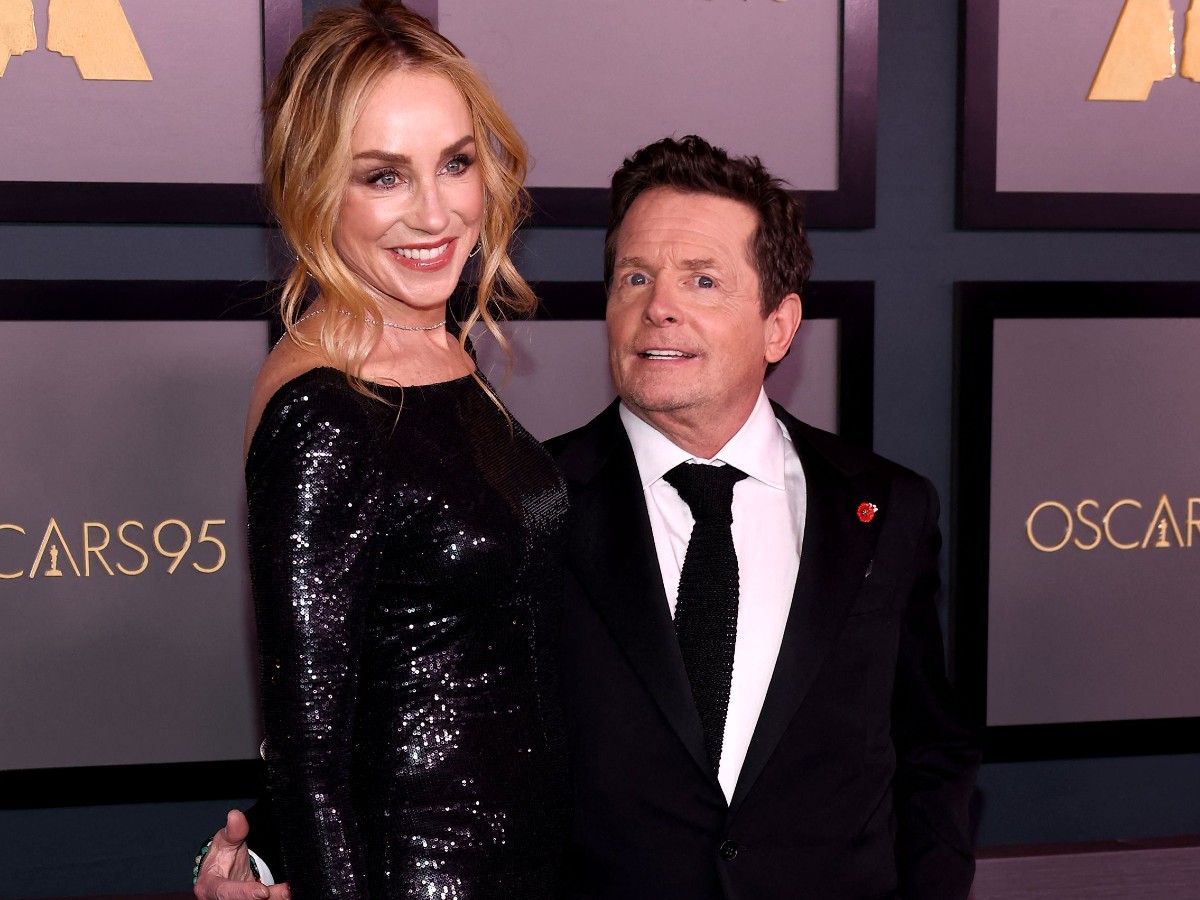 Michael J. Fox (R) standing with Tracy Pollan