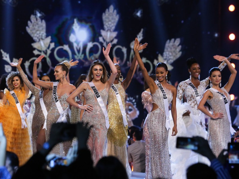 2018 photo of the Miss Universe stage full of contestants waving to the crowd
