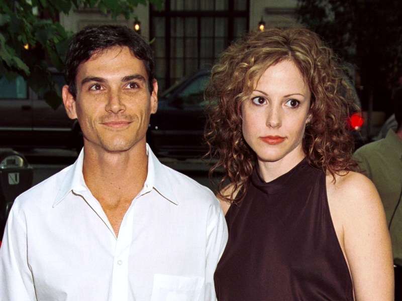 Billy Crudup in a white shirt with Mary Louise Parker in a purple sleeveless top