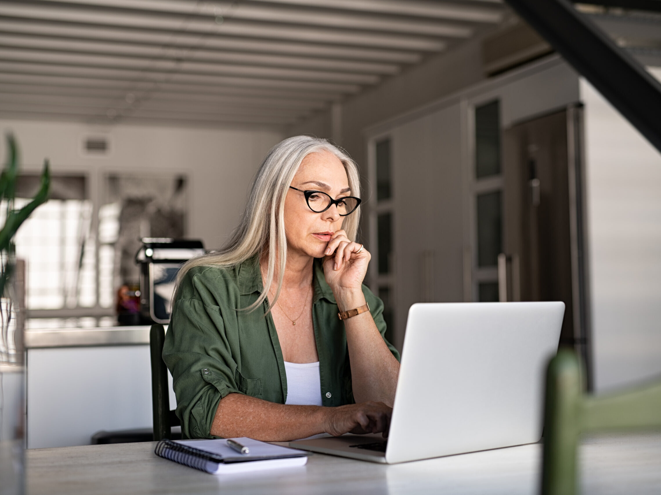 Midlife woman working at home