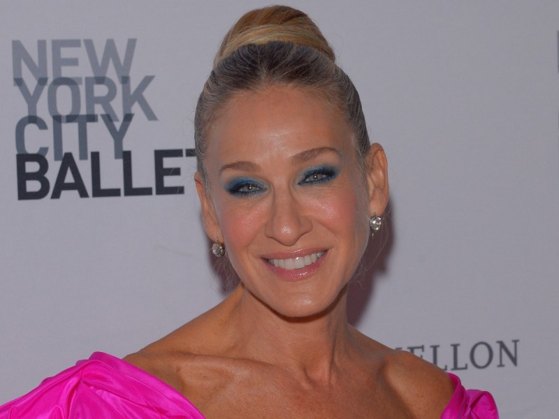 Sarah Jessica Parker smiles in hot pink dress