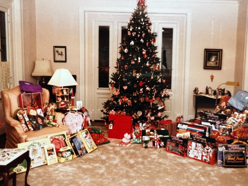 A Christmas tree with gifts underneath and to the side, including cabbage kids and GI Joe
