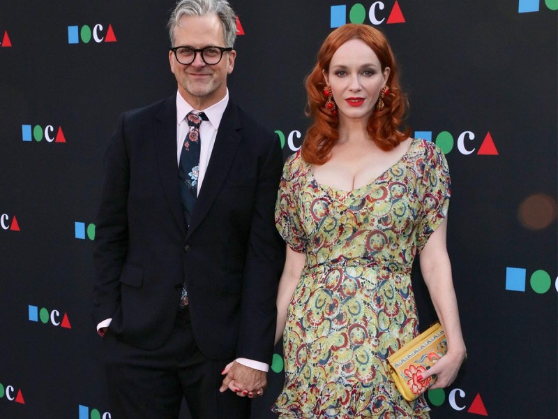 Christina Hendricks on the right, holding hands with her boyfriend George Bianchini