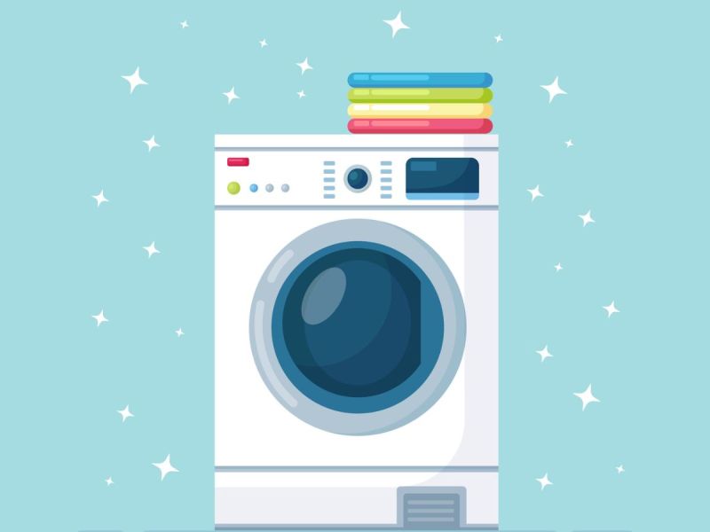 Front-load washing machine surrounded by sparkles