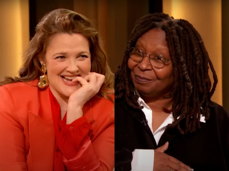 screenshots of Drew Barrymore smiling and biting her pinky and Whoopi Goldberg slyly smiling