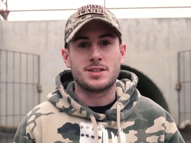 Patty Mayo wearing a camoflauge hoodie and hat