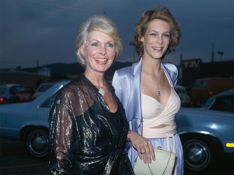 Janet Leigh on the left in a black dress, Jamie Lee Curtis on the right in white and blue, taken in 1979