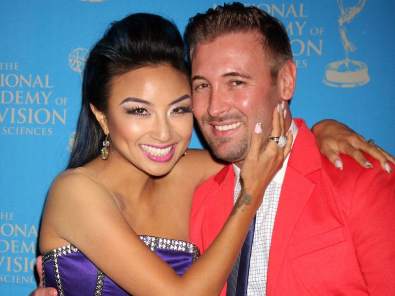Jeannie Mai with her arms around then-husband Freddy Harteis