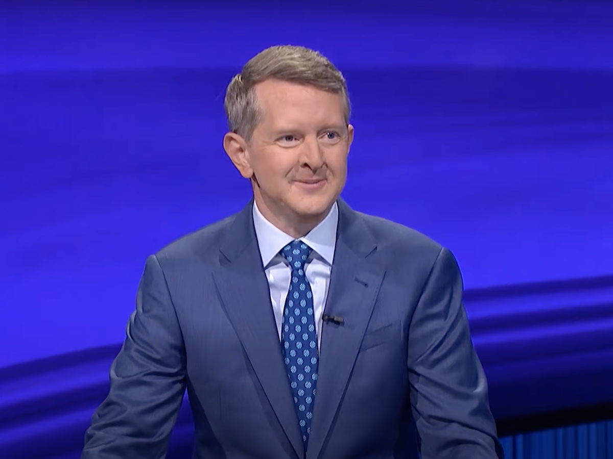 Ken Jennings smiling hosting Jeopardy