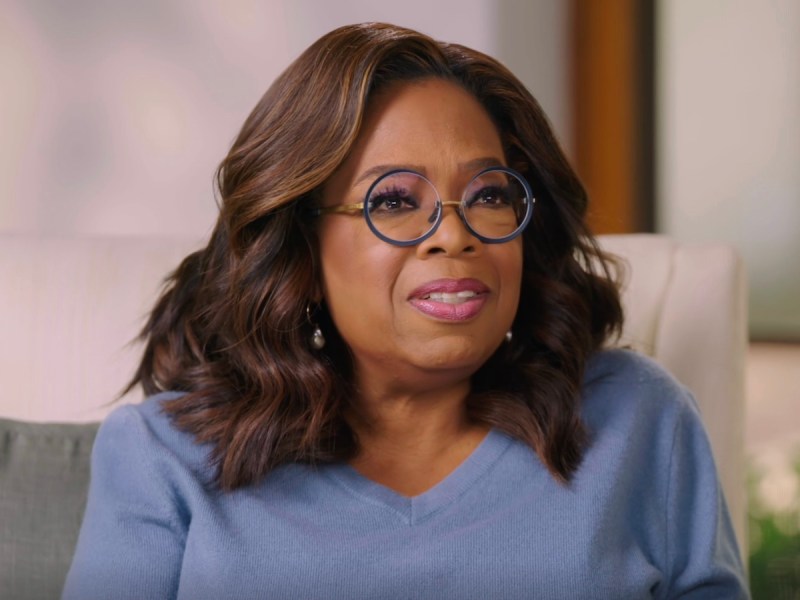 screenshot of Oprah Winfrey speaking while sitting in a foyer-type room