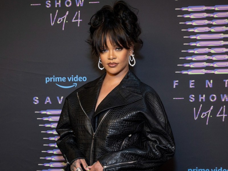 Rihanna poses in black leather jacket