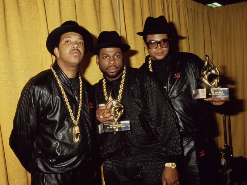 1987 photo of Run DMC holding awards together