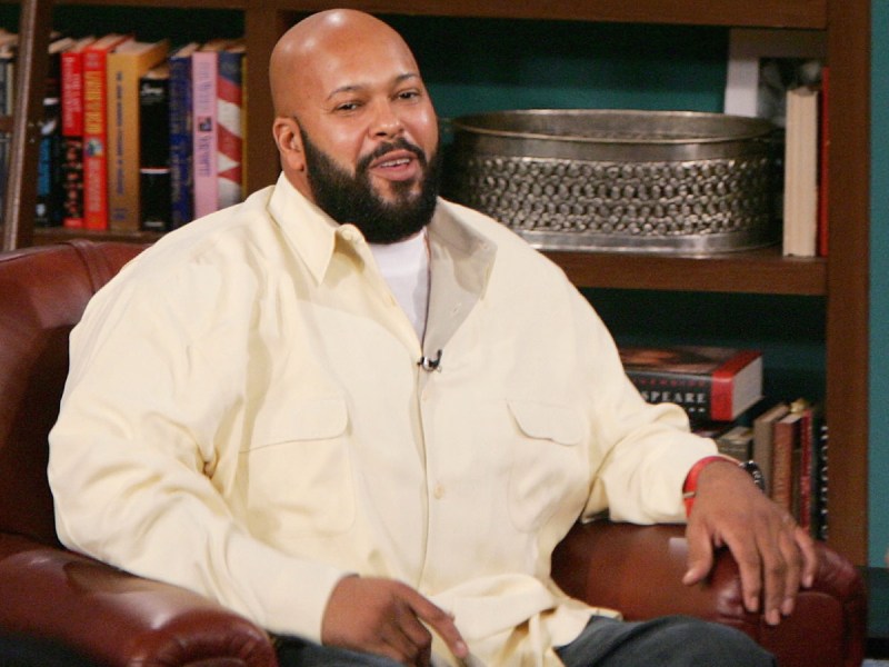 Suge Knight smiles in interview wearing cream-colored dress shirt
