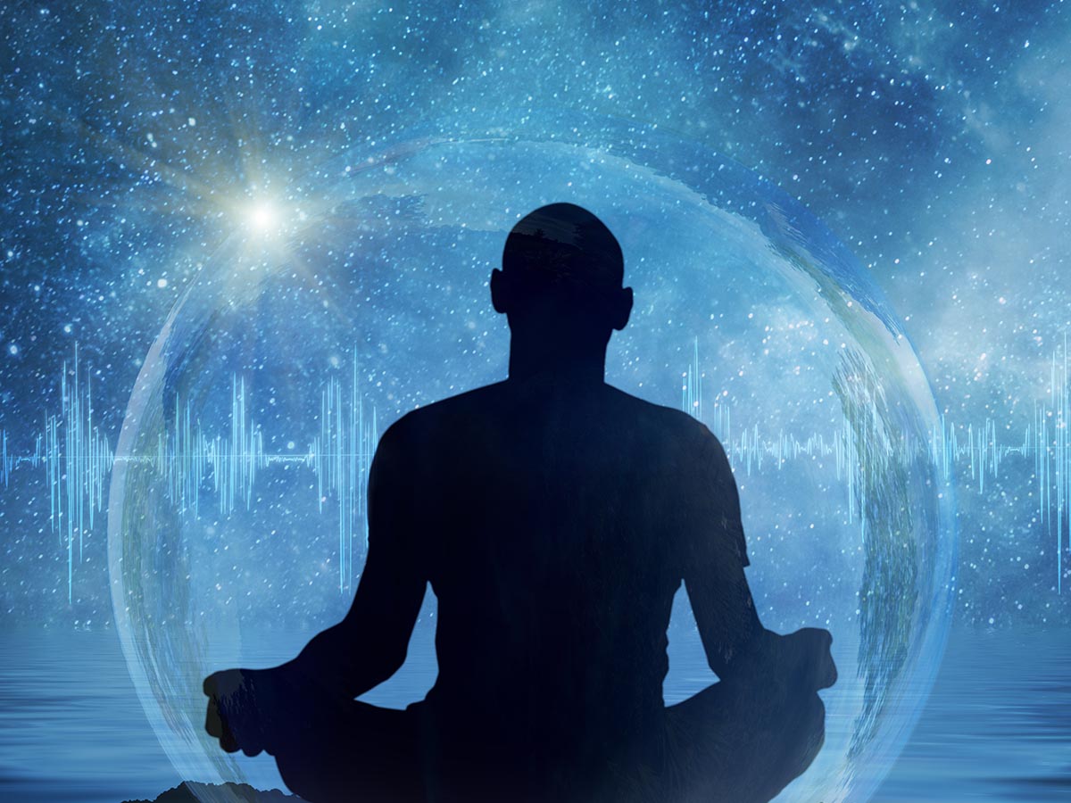 silhouette of a person meditating