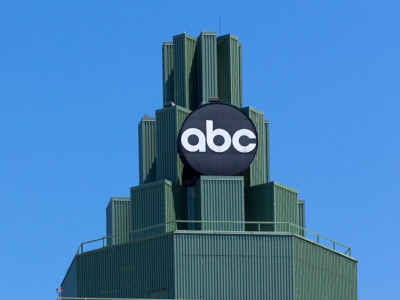 photo of the top of the Burbank ABC building against a blue sky