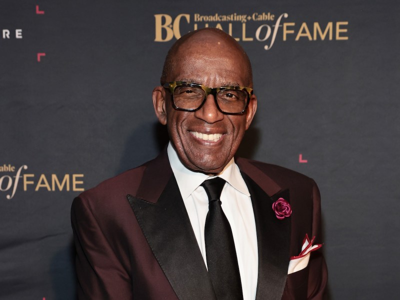 Al Roker smiling in a red suit