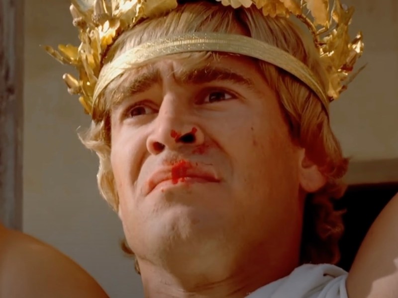screenshot of Colin Farrell as Alexander the Great wearing a golden laurel wreath on his head and blood on his nose and lips