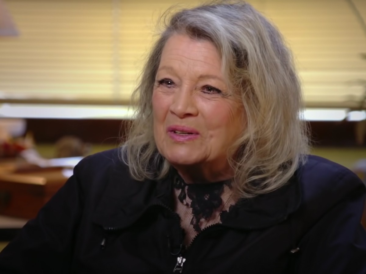 Screenshot of Angie Dickinson speaks while wearing a black jacket