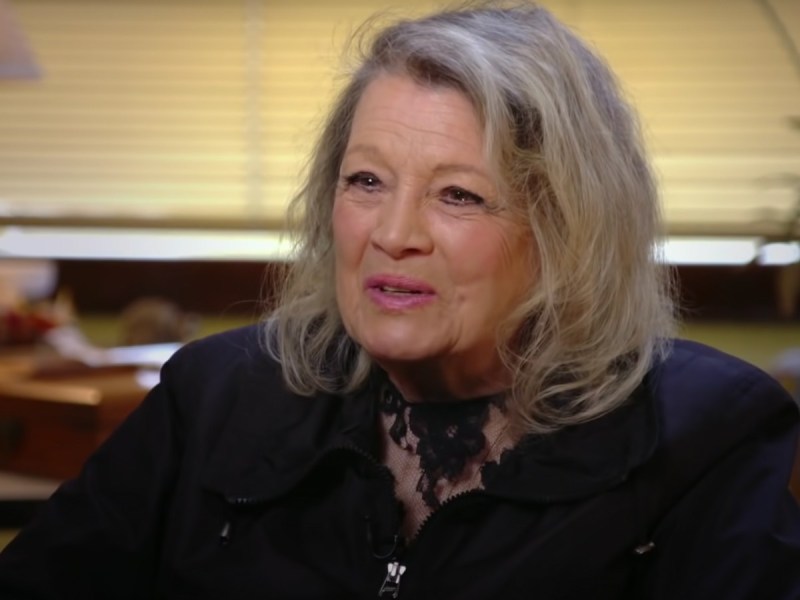 Screenshot of Angie Dickinson speaks while wearing a black jacket
