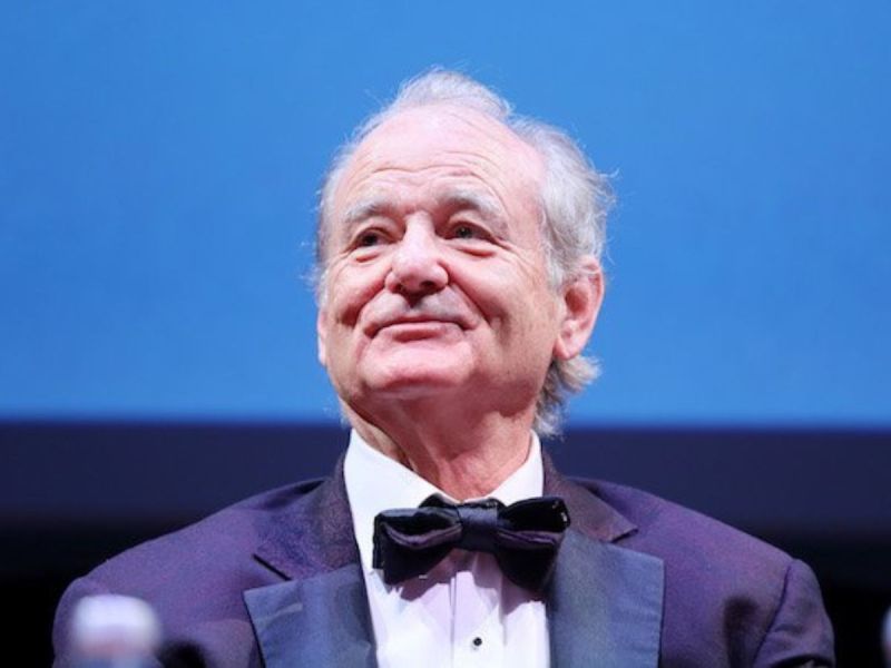 Bill Murray in a tuxedo against a blue background