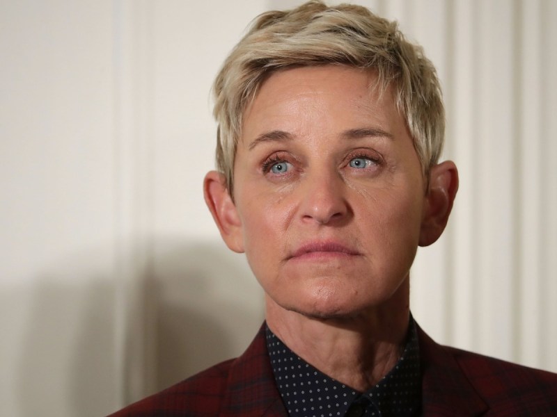 Closeup photo of Ellen Degeneres looking somber against white backddrop