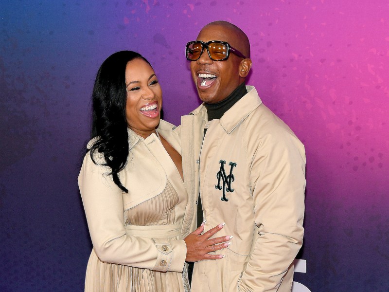 Ja Rule and Aisha Atkins smiling and laughing together in matching tan outfits looking very happy together