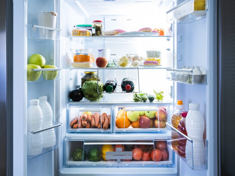 An open refrigerator with food inside